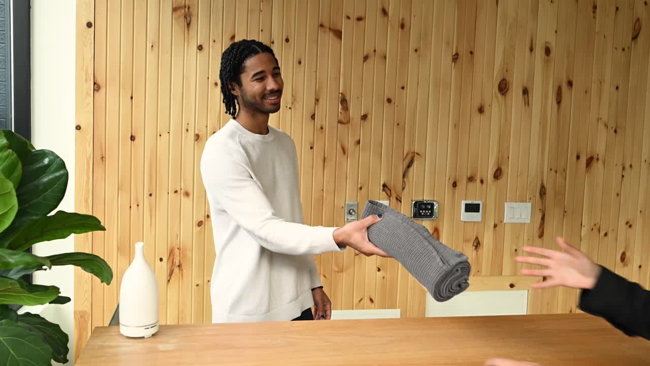 Alter Wellness reception area with warm natural wood paneling