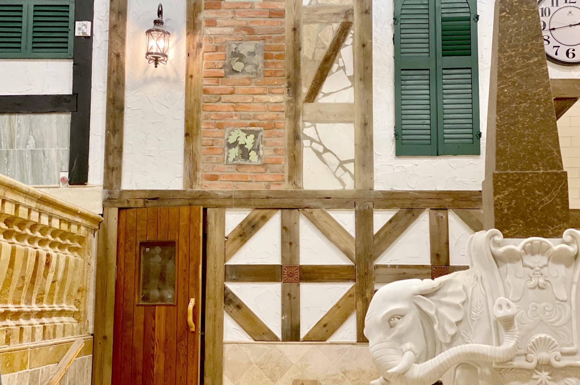 Interior of Banya No. 2 sauna hall with traditional timber-frame architecture and brick accents
