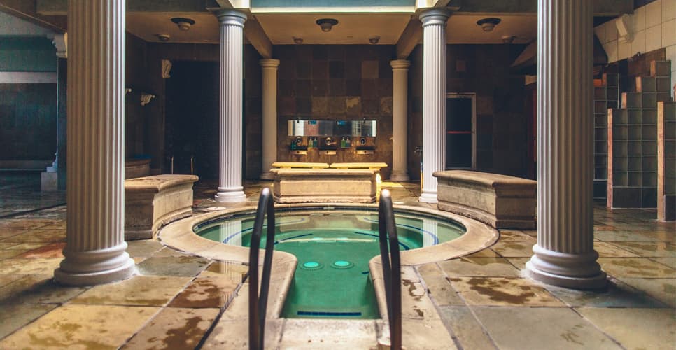 City Spa pool and cold plunge area with classical columns