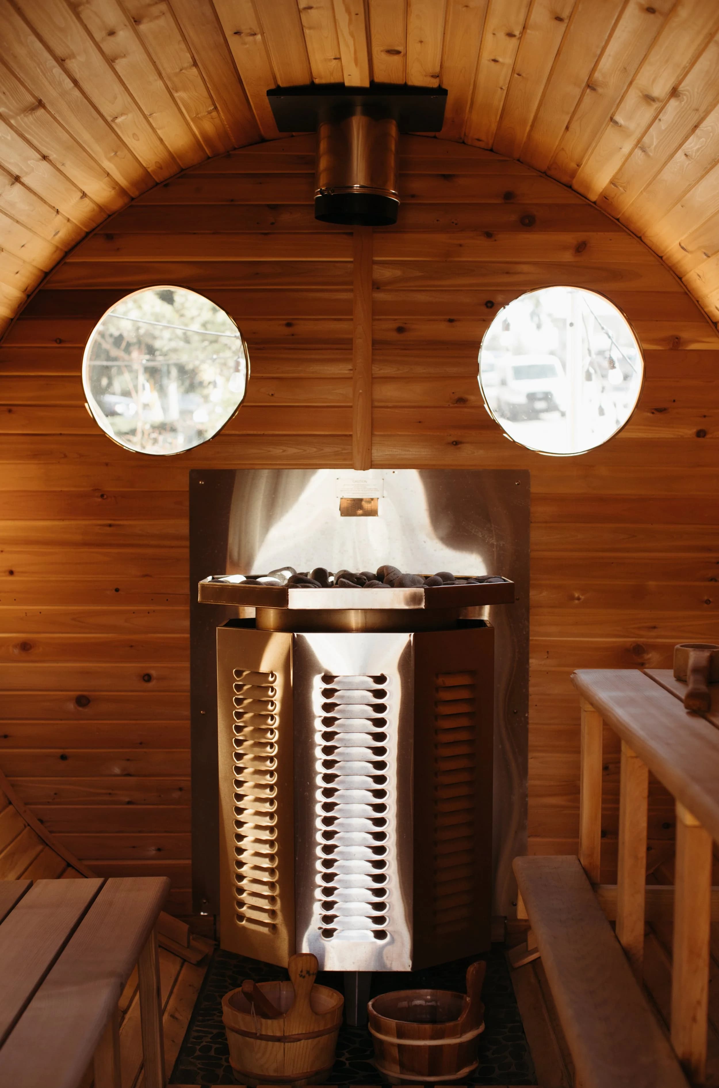 Hot Spot barrel sauna interior with heater and wooden benches