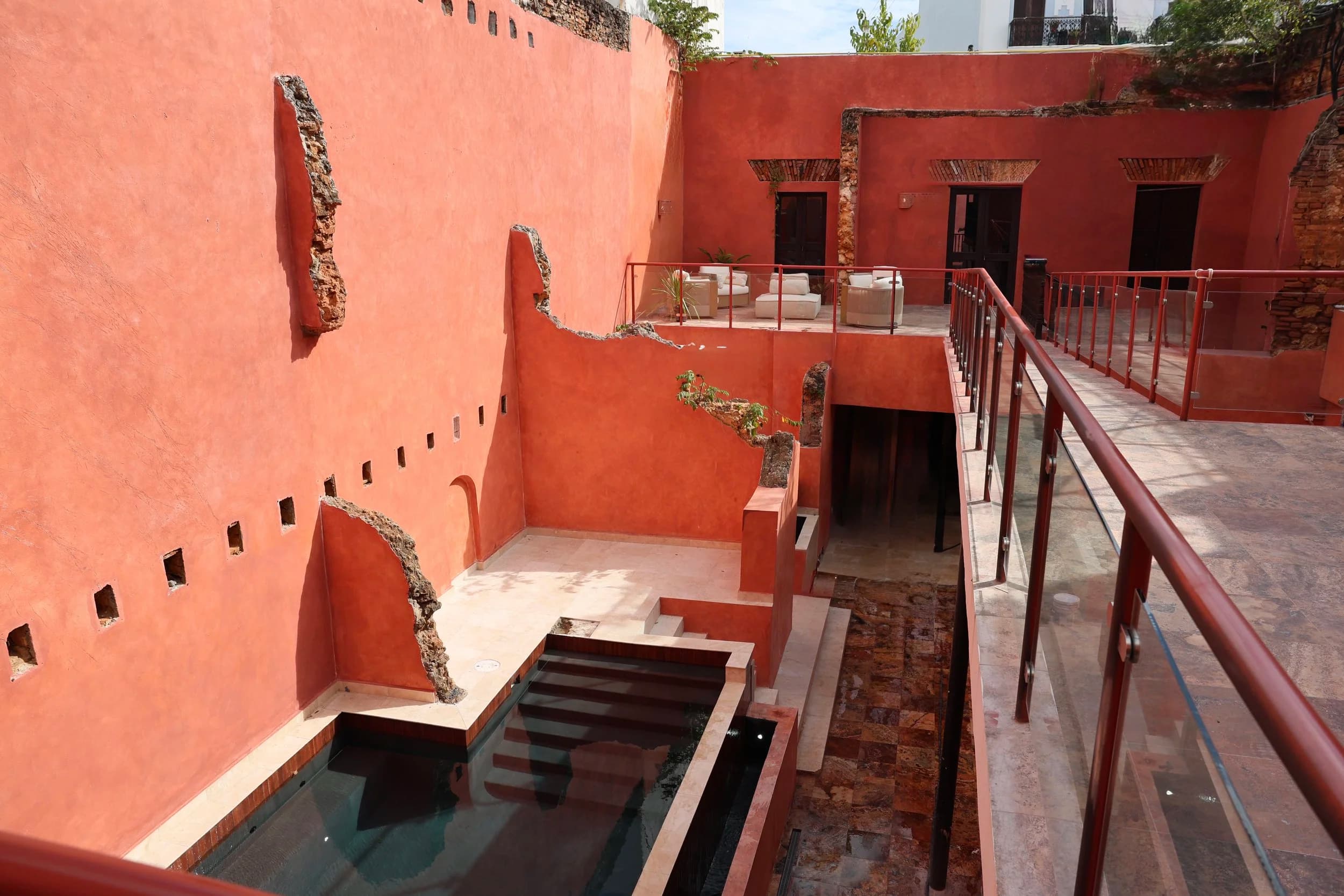 Las Ruinas Bathhouse rooftop courtyard with pools and lounge seating