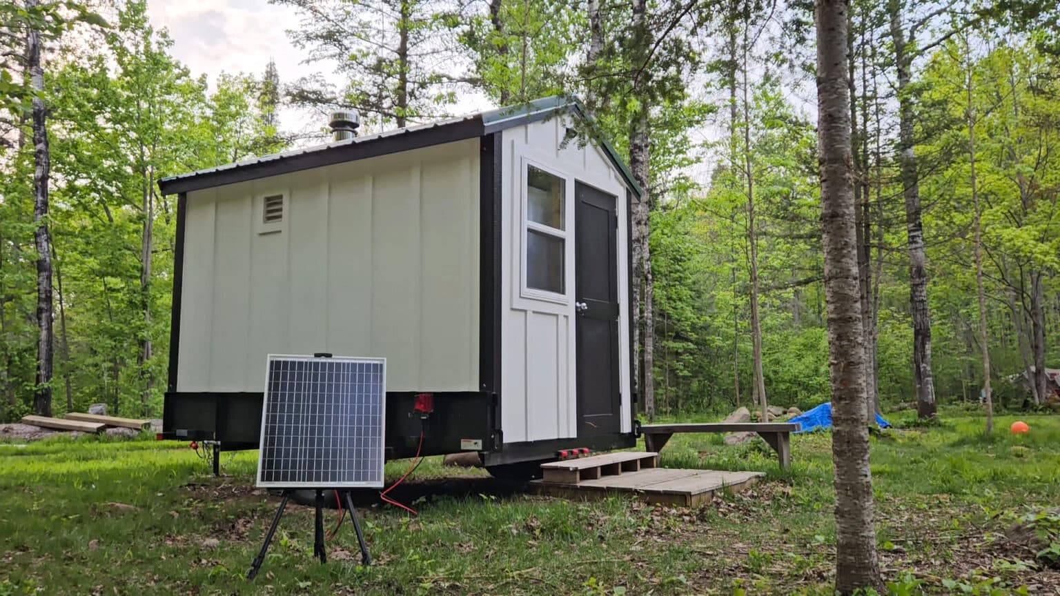Minnesota Mobile Sauna trailer with solar panel in natural setting