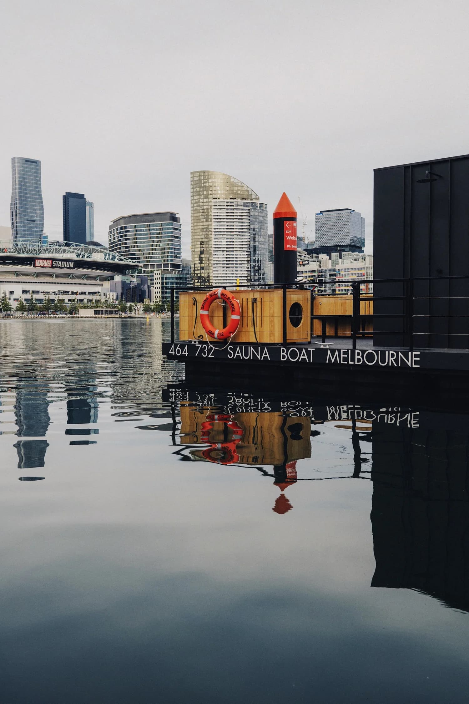 Sauna Boat Melbourne floating sauna at Victoria Harbour with city skyline