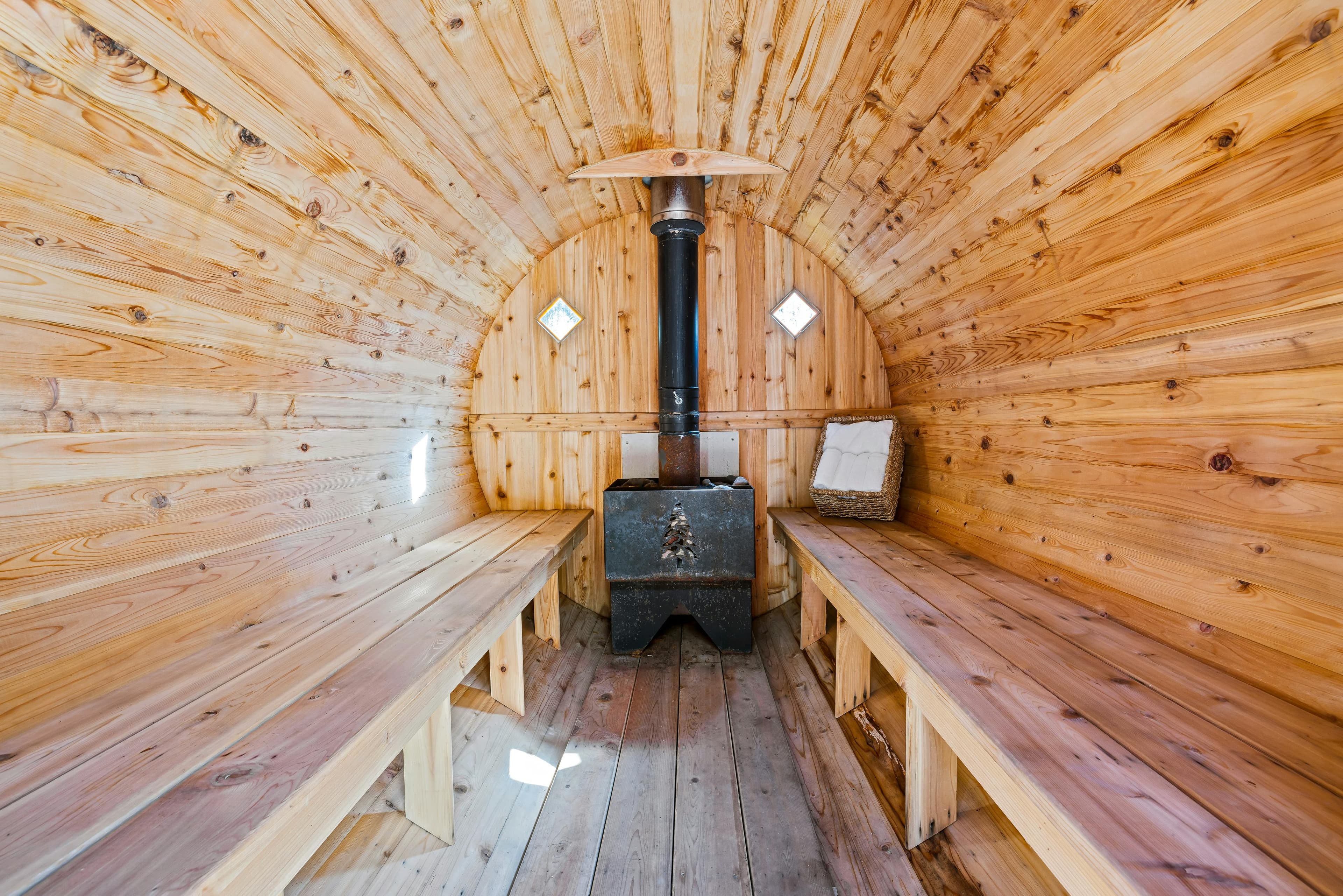 Simply Sauna mobile wood-fired Finnish sauna interior with stove and benches