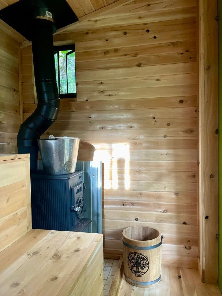 Interior of the wood-fired cedar sauna at Stone City Forest Spa in Hardwick, Vermont