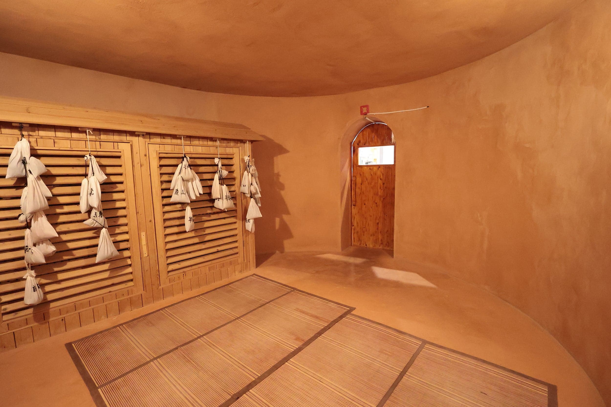 The SPA Club red clay sauna room interior