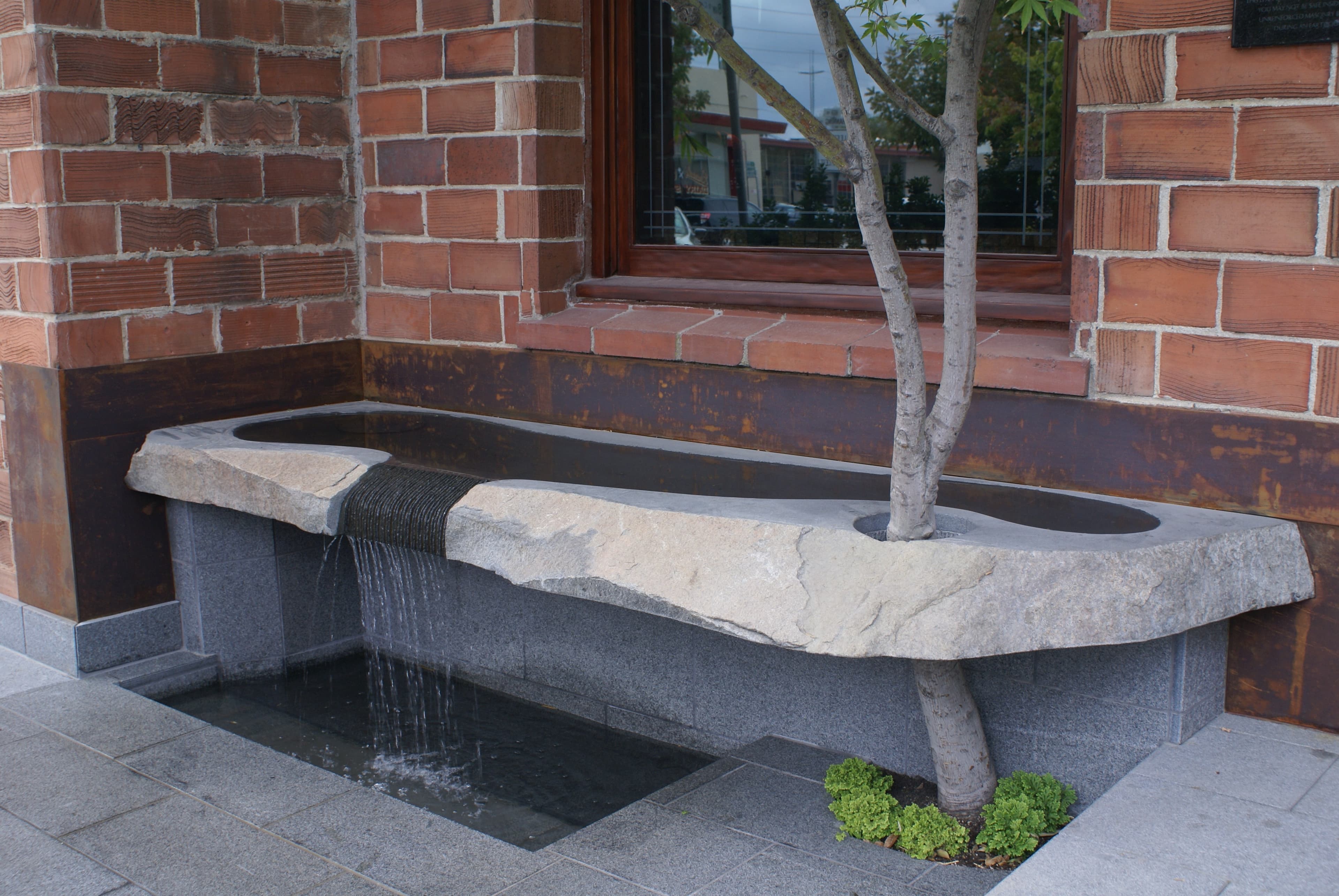 Watercourse Way entrance fountain and brick building facade