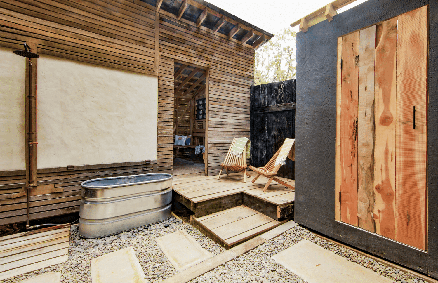 You Are Here Sauna outdoor courtyard with cold plunge tub and lounge area in Durham, NC