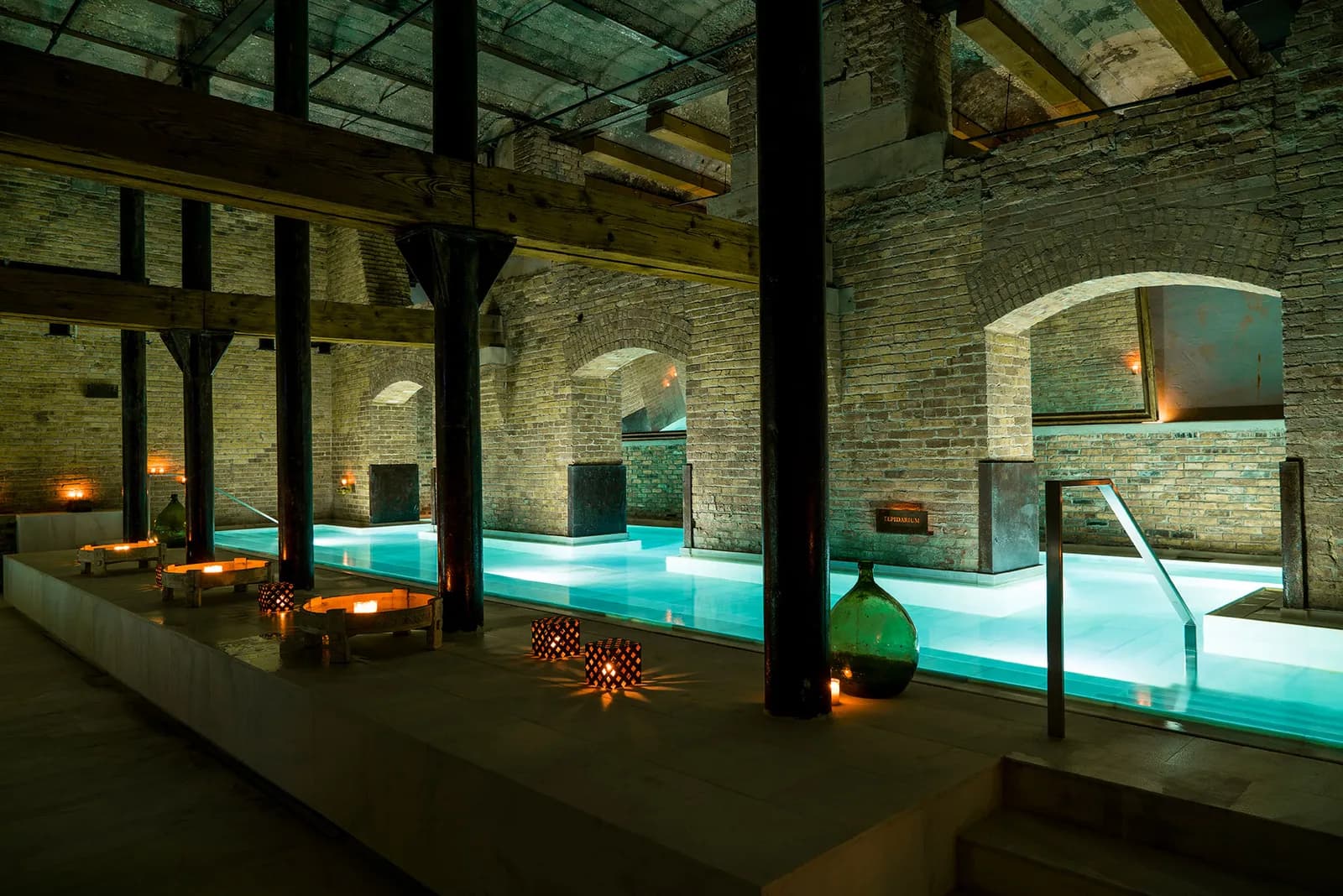 AIRE Ancient Baths Chicago candlelit thermal baths with exposed brick walls and stone architecture