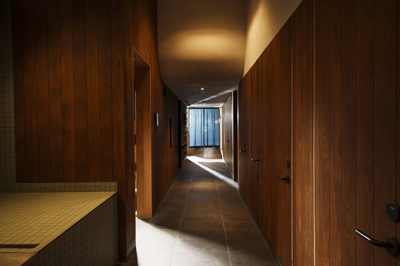 Warm wood sauna interior at Akari Sauna