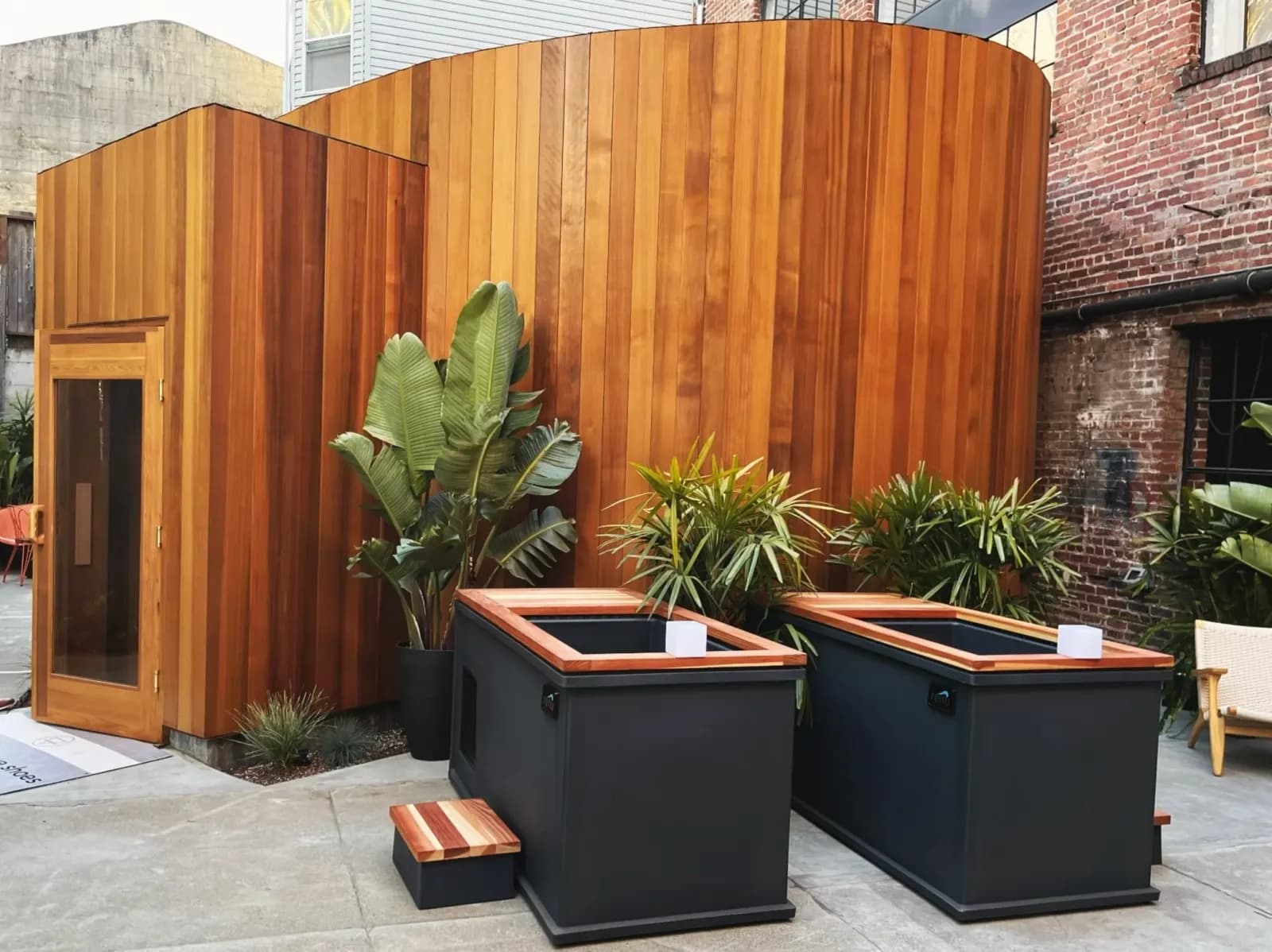 Alchemy Springs sauna building and cold plunge courtyard