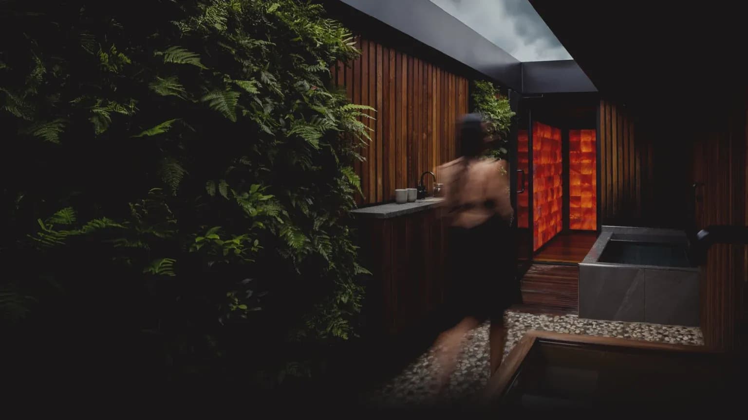 Circle Wellness private circuit with cold plunge, planted wall, and glowing salt-walled sauna
