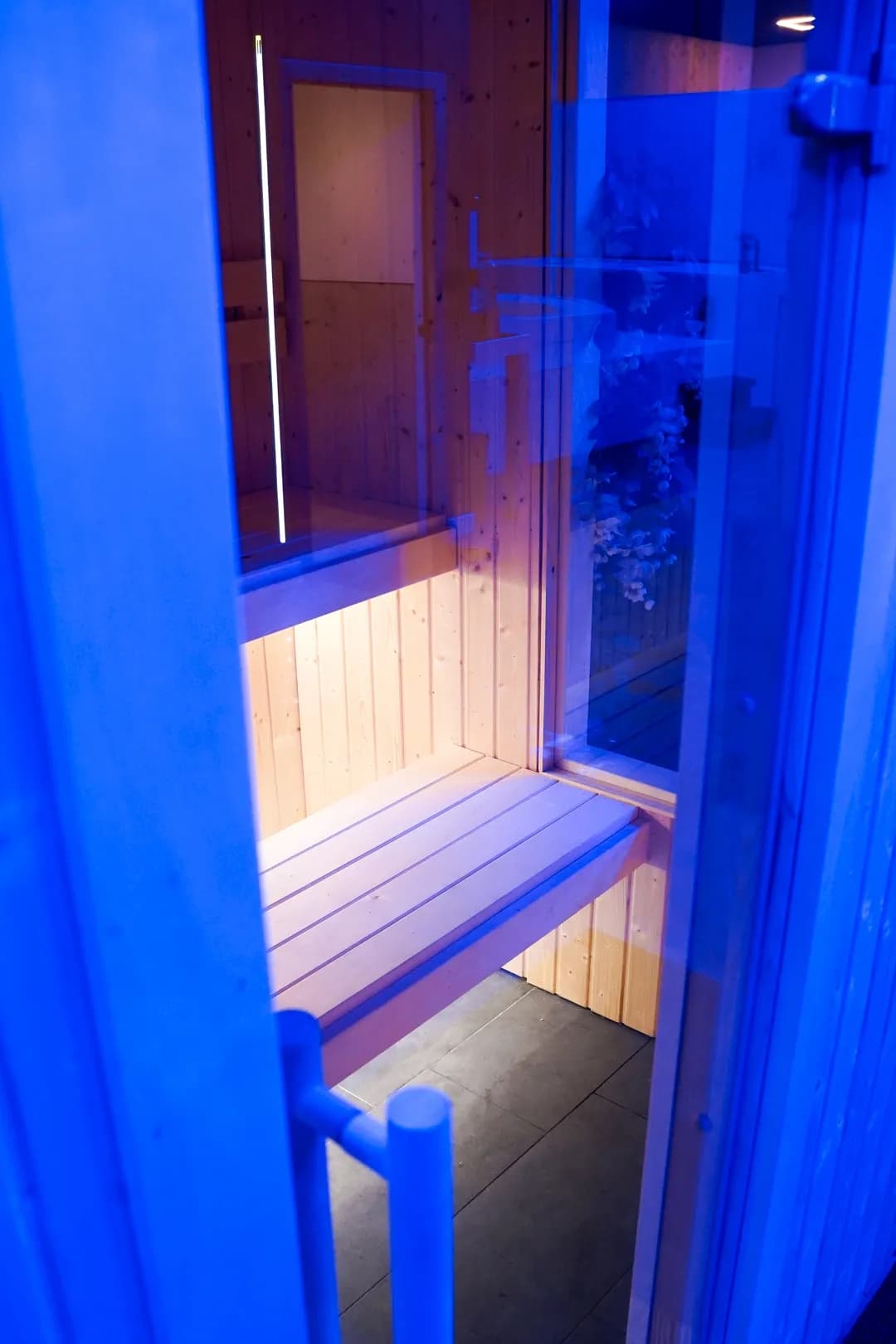 Blue-lit sauna interior at Dopamine Recovery Suite in East Kilbride