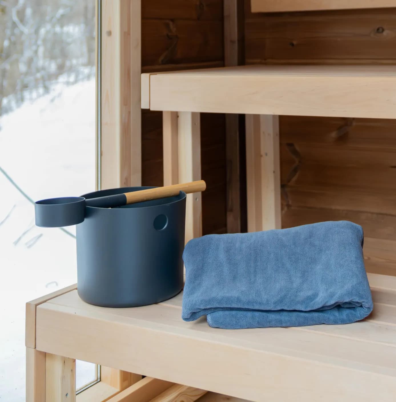 Sauna bench with bucket and towel at East Burke Sauna Club
