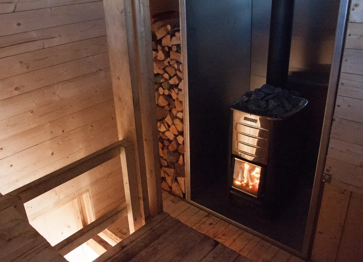 Wood-fired Harvia stove inside Eldmølla