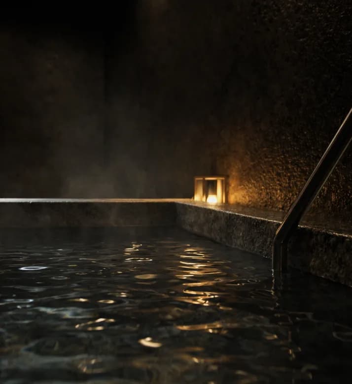 Steaming Japanese hot tub with a lantern beside it