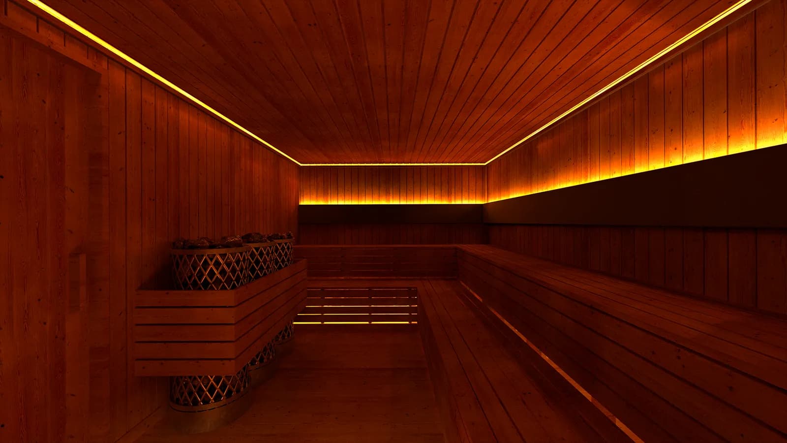 Wood-lined sauna interior with bench seating and a stone heater