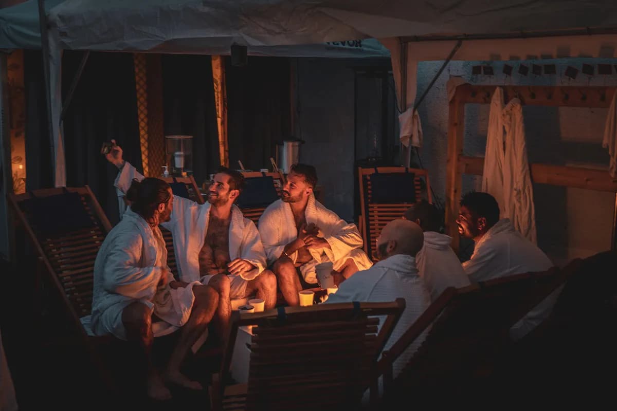 Gatherwell guests relaxing in robes in the outdoor lounge area