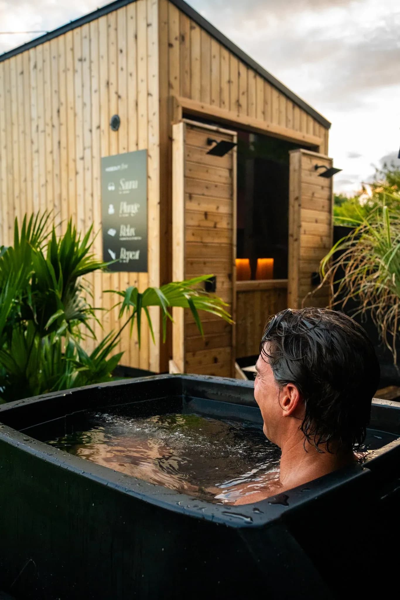 Hideout Sauna Village outdoor cold plunge with sauna building
