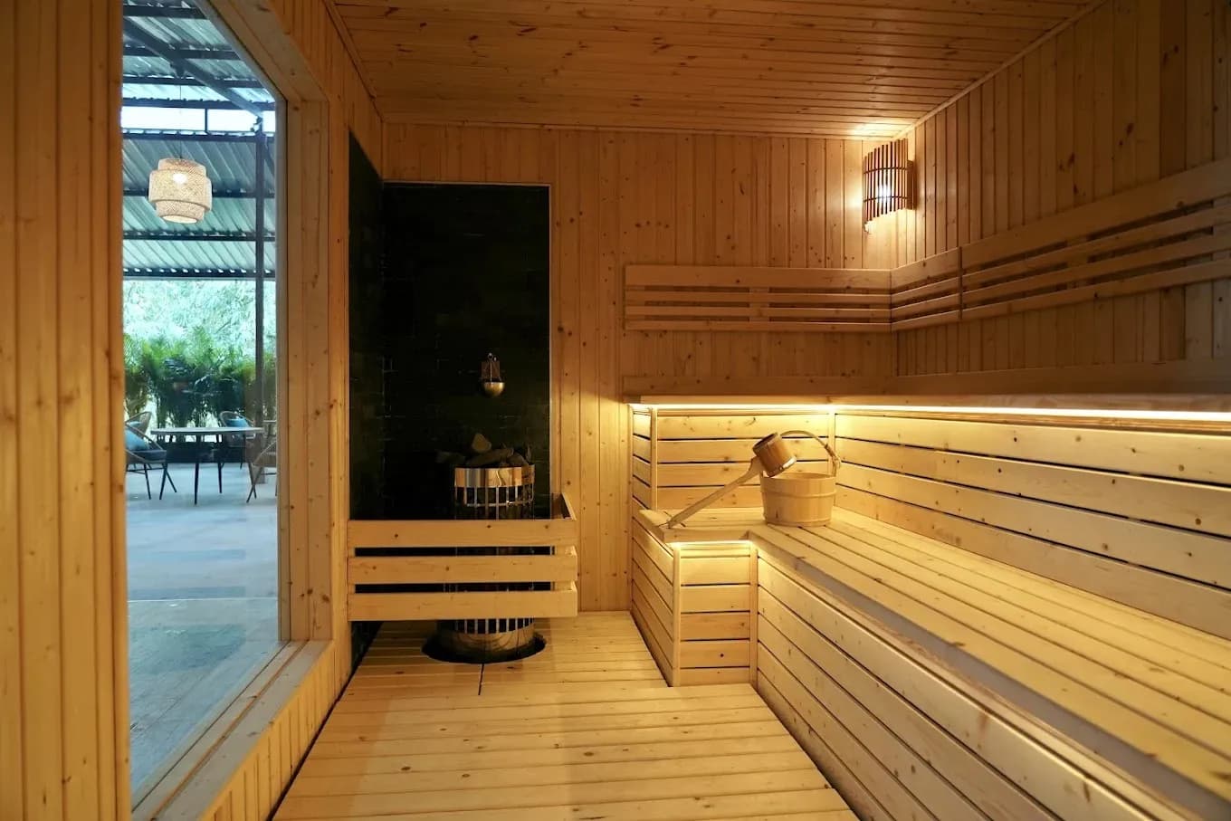 Finnish dry sauna interior at KEDR Spa Phuket with multi-tier wooden benches