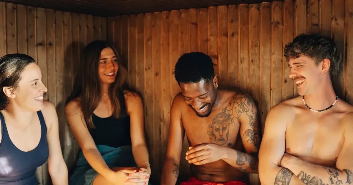 Guests sharing a community session inside the cedar sauna