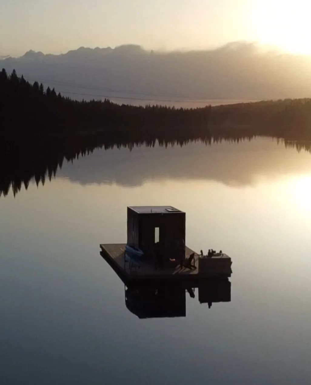 Ritual Floating Sauna on Twin Lake surrounded by boreal forest in central Alberta