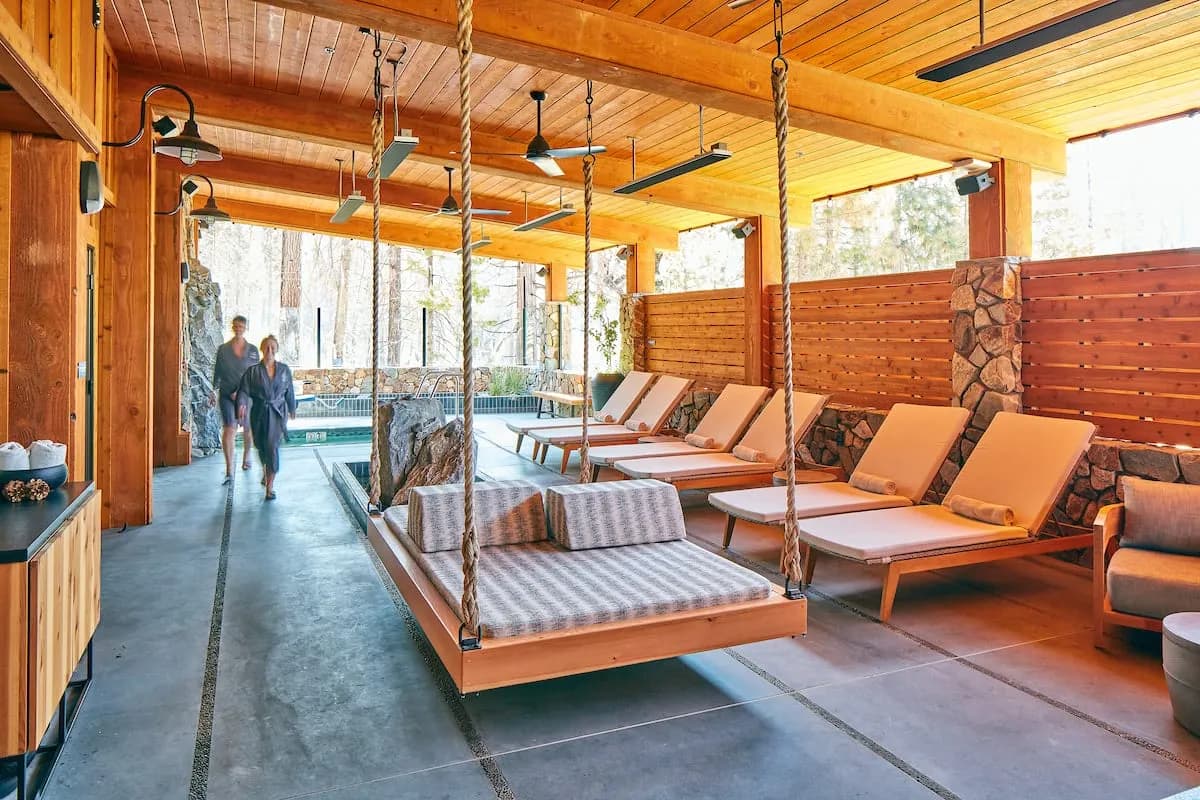 Rush Creek Spa outdoor lounge with heated mineral hot tub