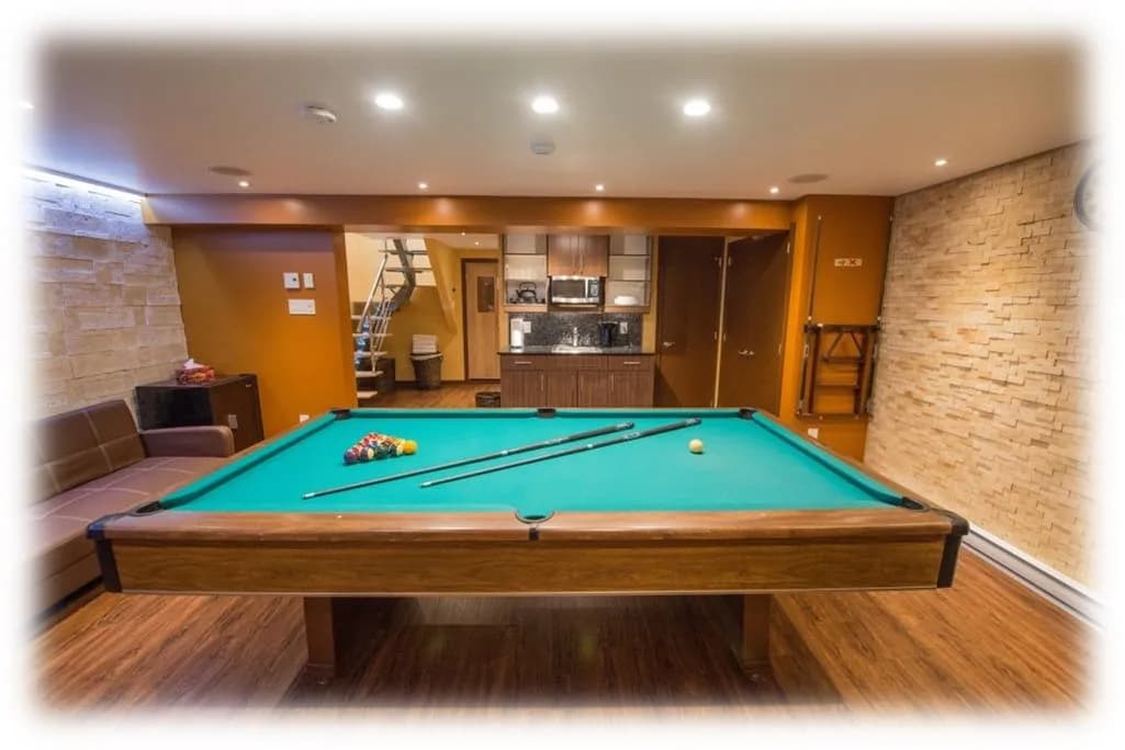 Gathering room with pool table and kitchenette