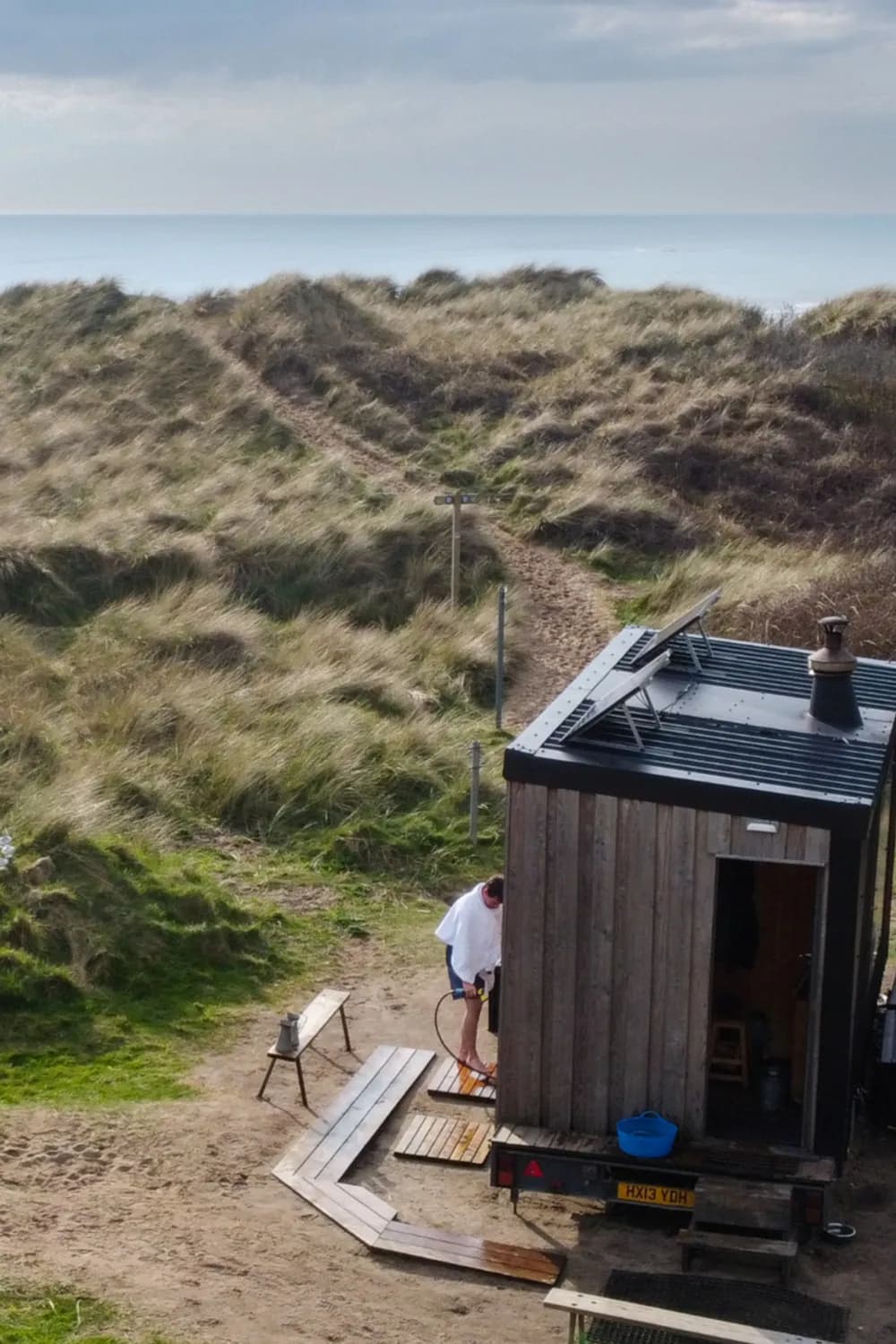 Aerial view of Sawna Bach beach sauna at Porth Tyn Tywyn, Anglesey