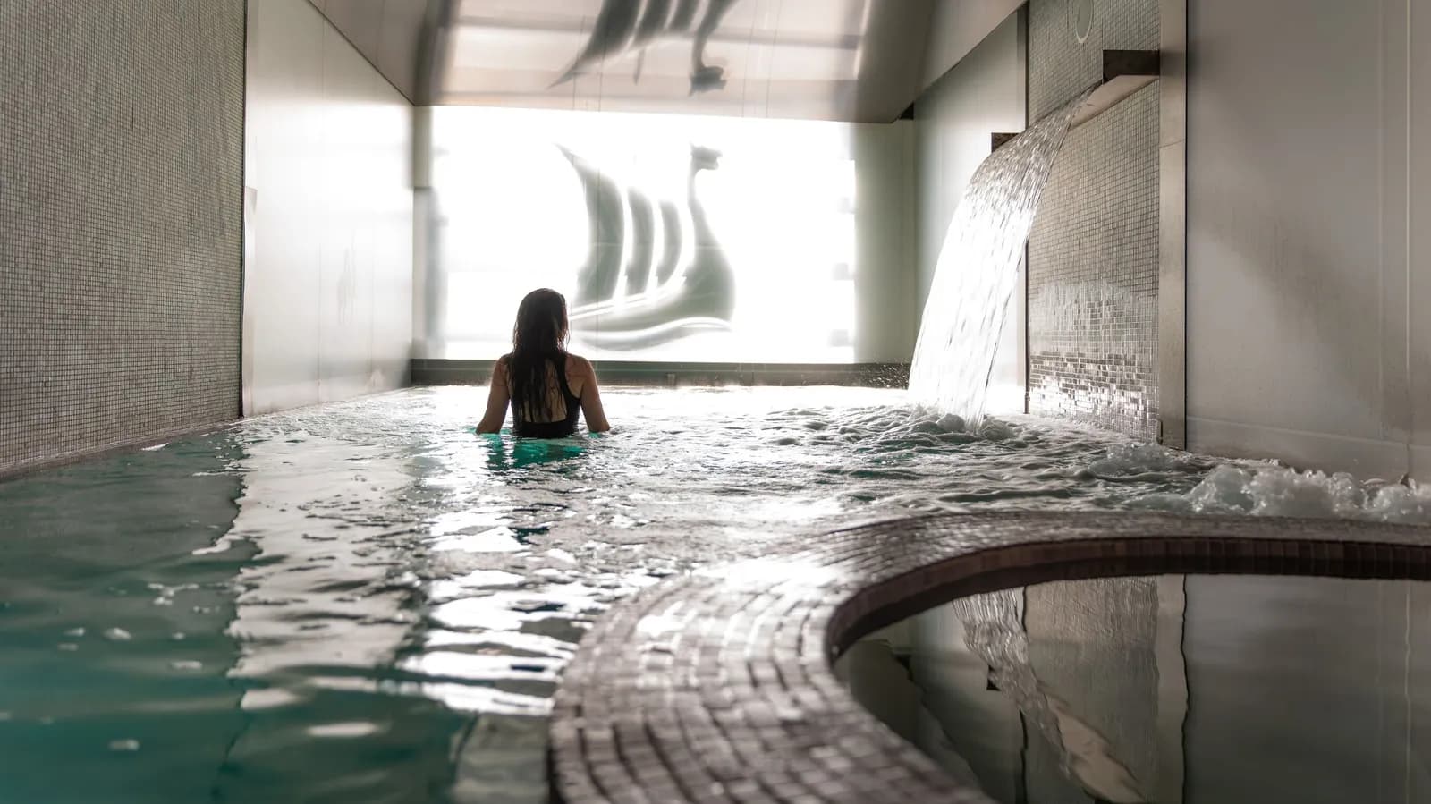 Hydrojet hot bath with thermal waterfall at Scandinave Spa Vieux-Montréal