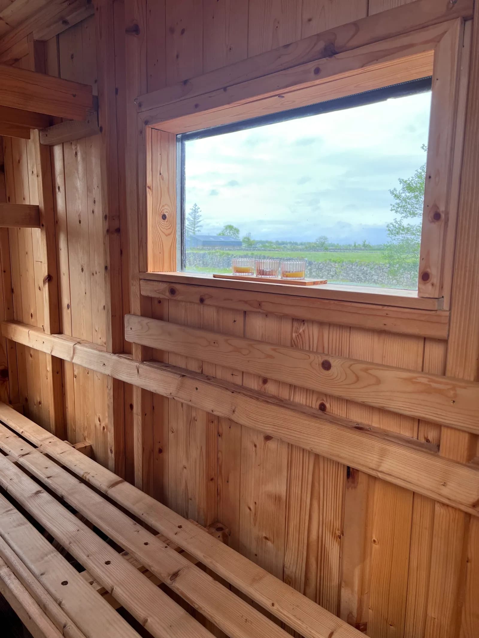 Sauna interior at Sonny's Sauna in Ballyglunin Station, Galway with countryside views