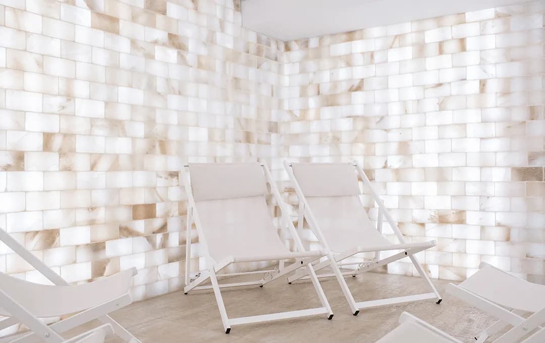 Himalayan salt halotherapy room with lounge chairs at Spa William Gray