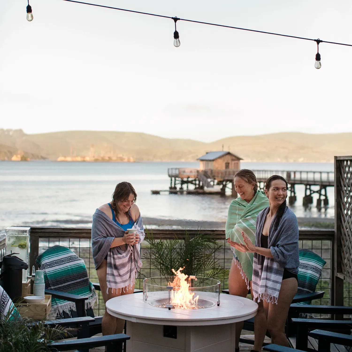 Fire pit lounge area at Sundrop Sauna overlooking Tomales Bay