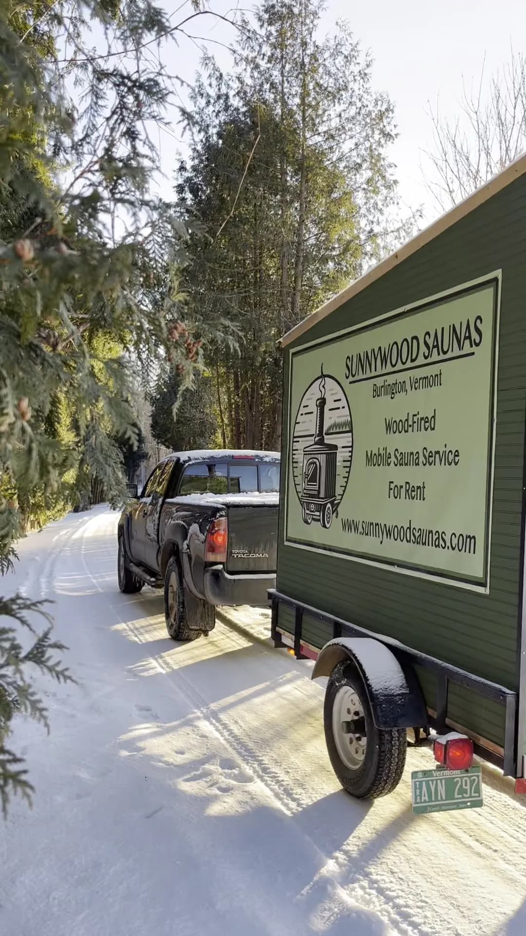 Sunnywood Saunas wood-fired mobile sauna trailer on a snowy road