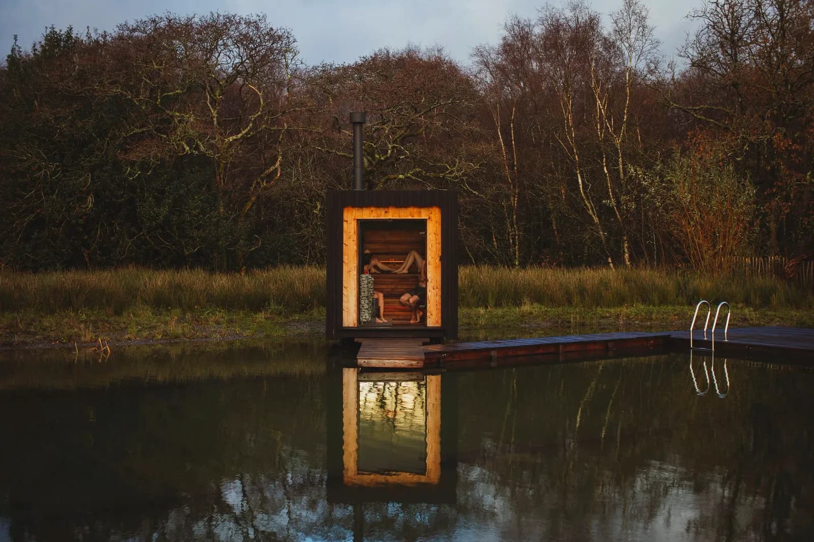 Natural swimming pool surrounded by Welsh countryside at The Wood Stars