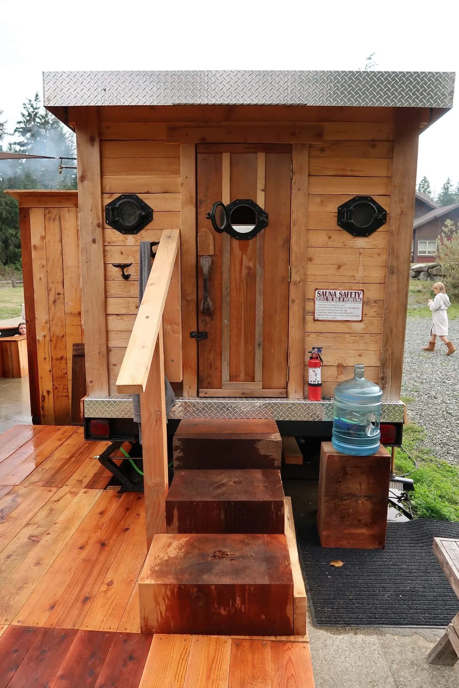 Front of the Porthole Sauna showing portholes on the door at Triple Peak Sauna Co.