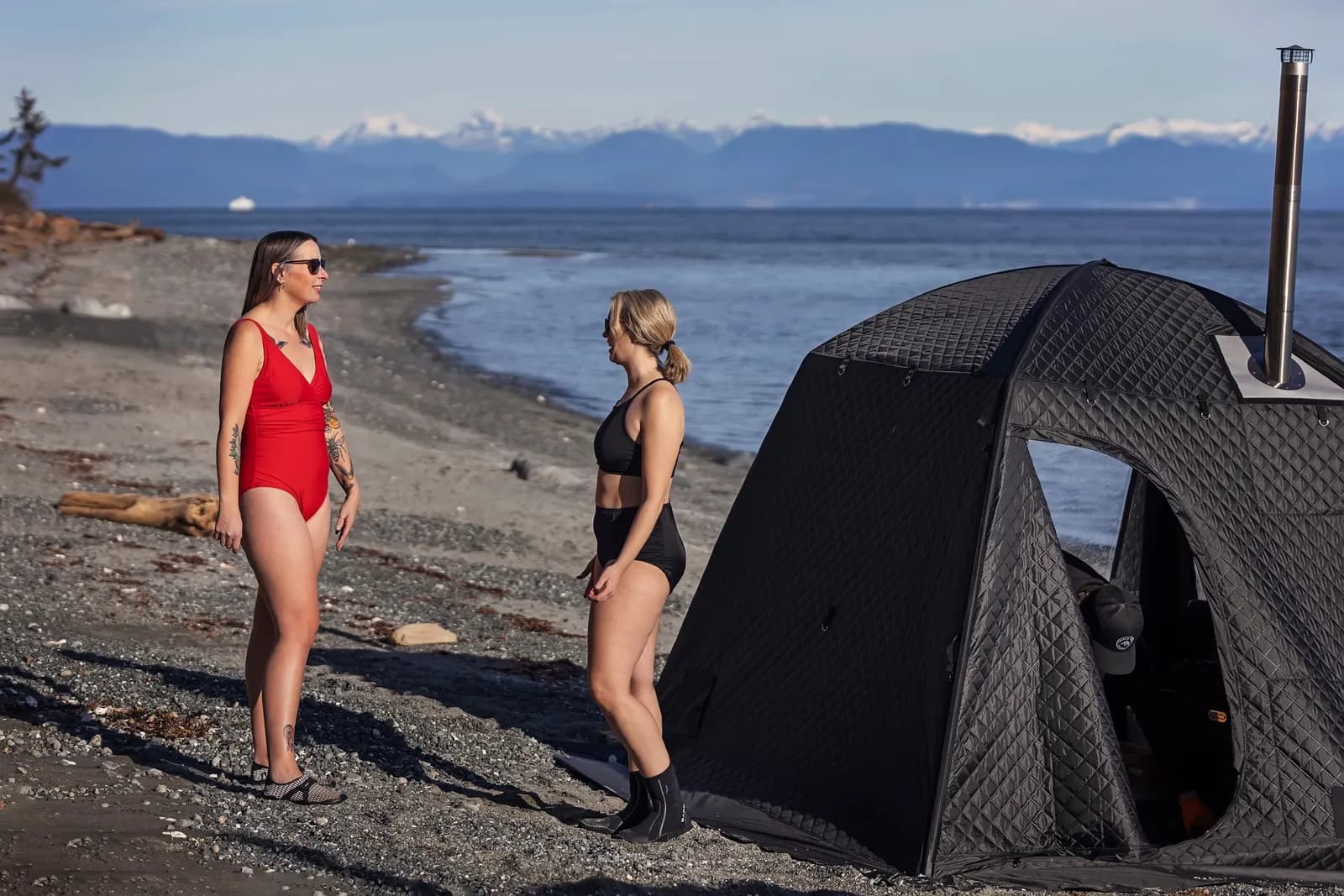 Triple Peak wood-fired tent sauna on a Comox Valley beach with the Coast Mountains beyond