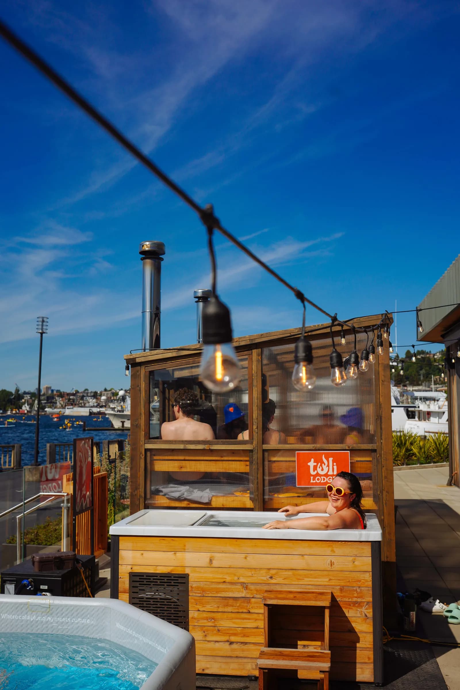Tuli Lodge glass-walled wood-fired sauna at Pier 62 on the Seattle waterfront