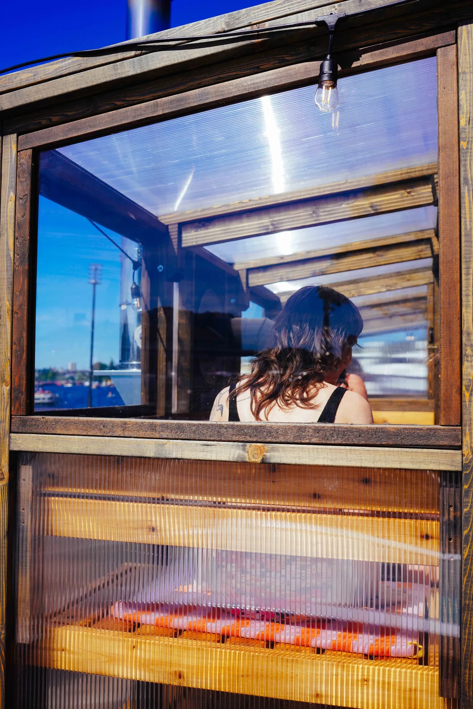 Interior of Tuli Lodge sauna at Pier 62 looking out over Elliott Bay