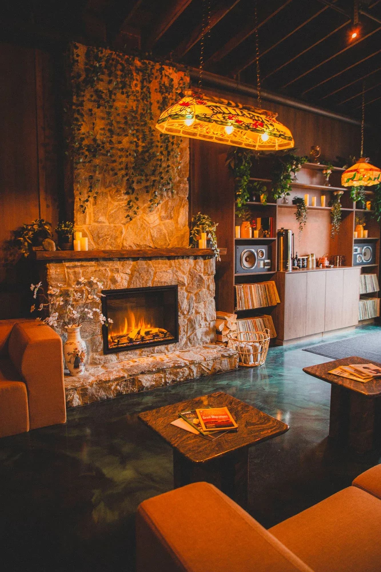 Under The Rose Sauna House lounge with fireplace