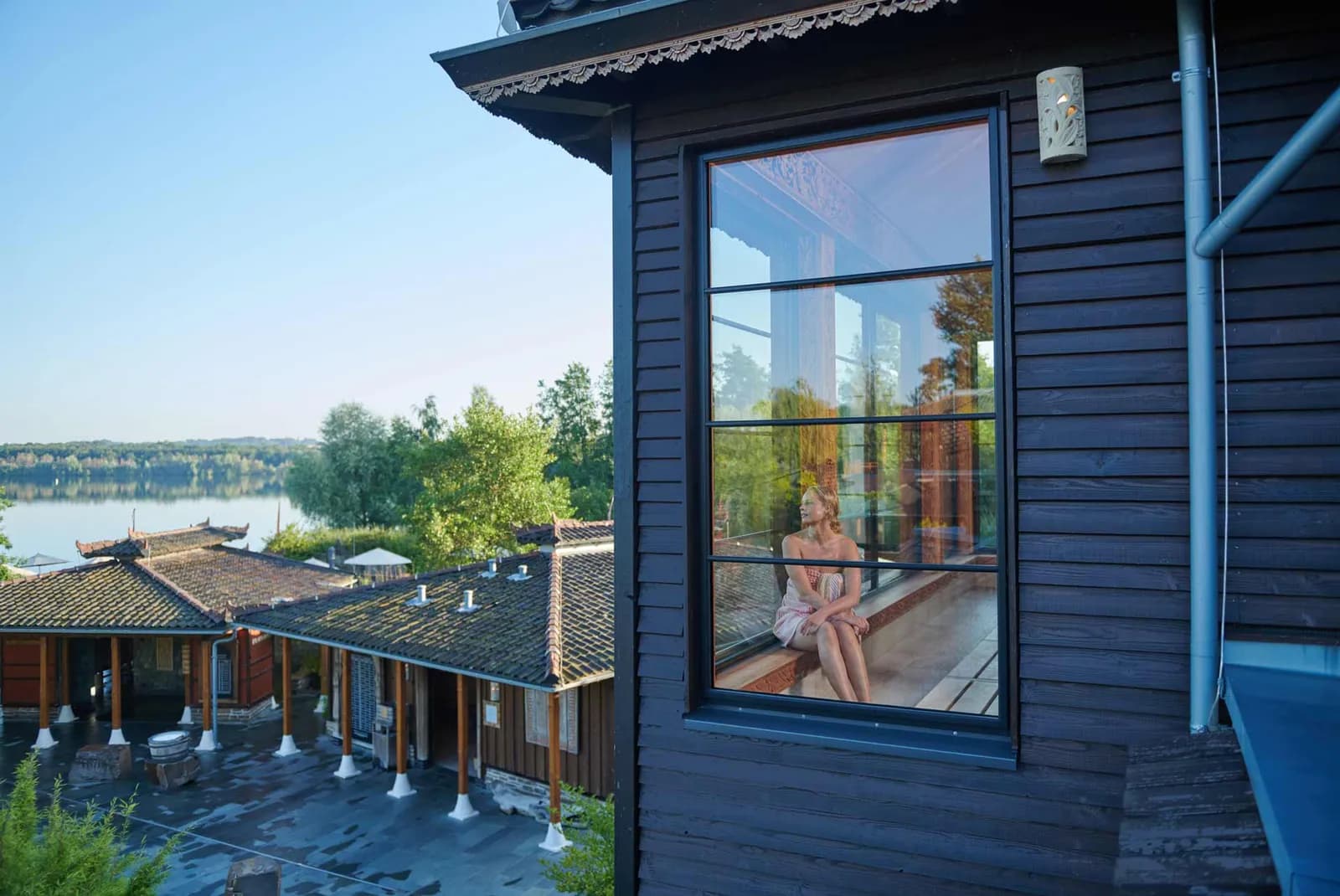 Panorama sauna at Vabali Spa Düsseldorf with large windows overlooking the garden