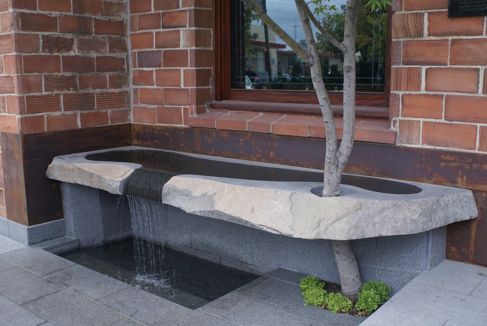 Watercourse Way entrance fountain and brick building facade