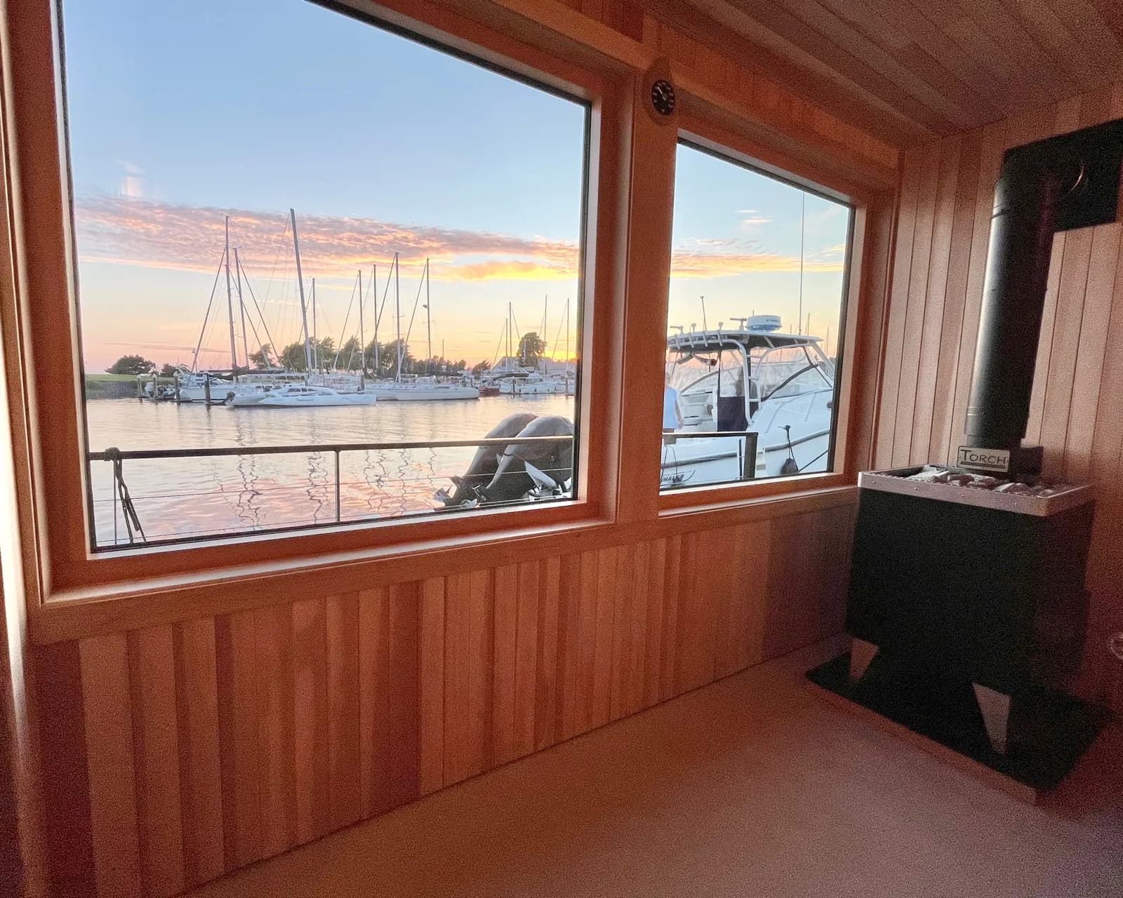 Coho Saunas floating sauna docked at sunset on Bellingham Bay