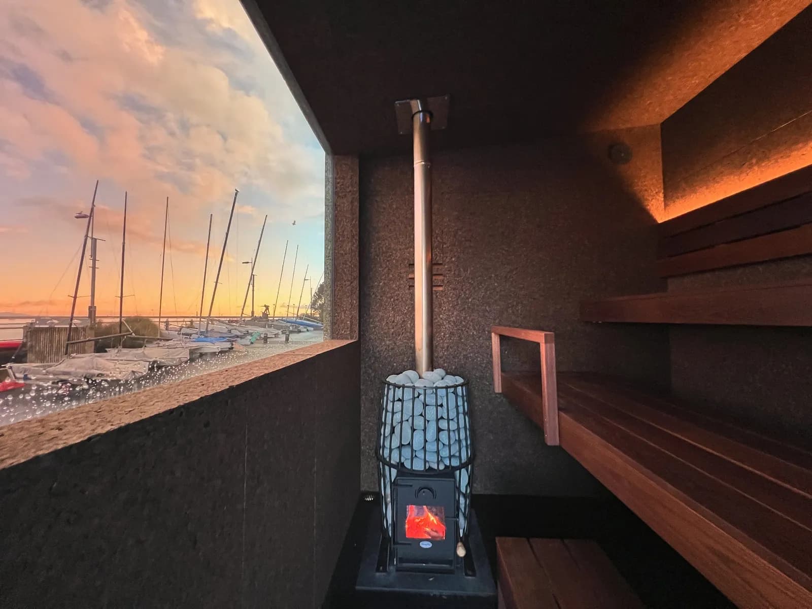 Interior of Goodheat Sauna at Nelson Yacht Club with panoramic harbor views