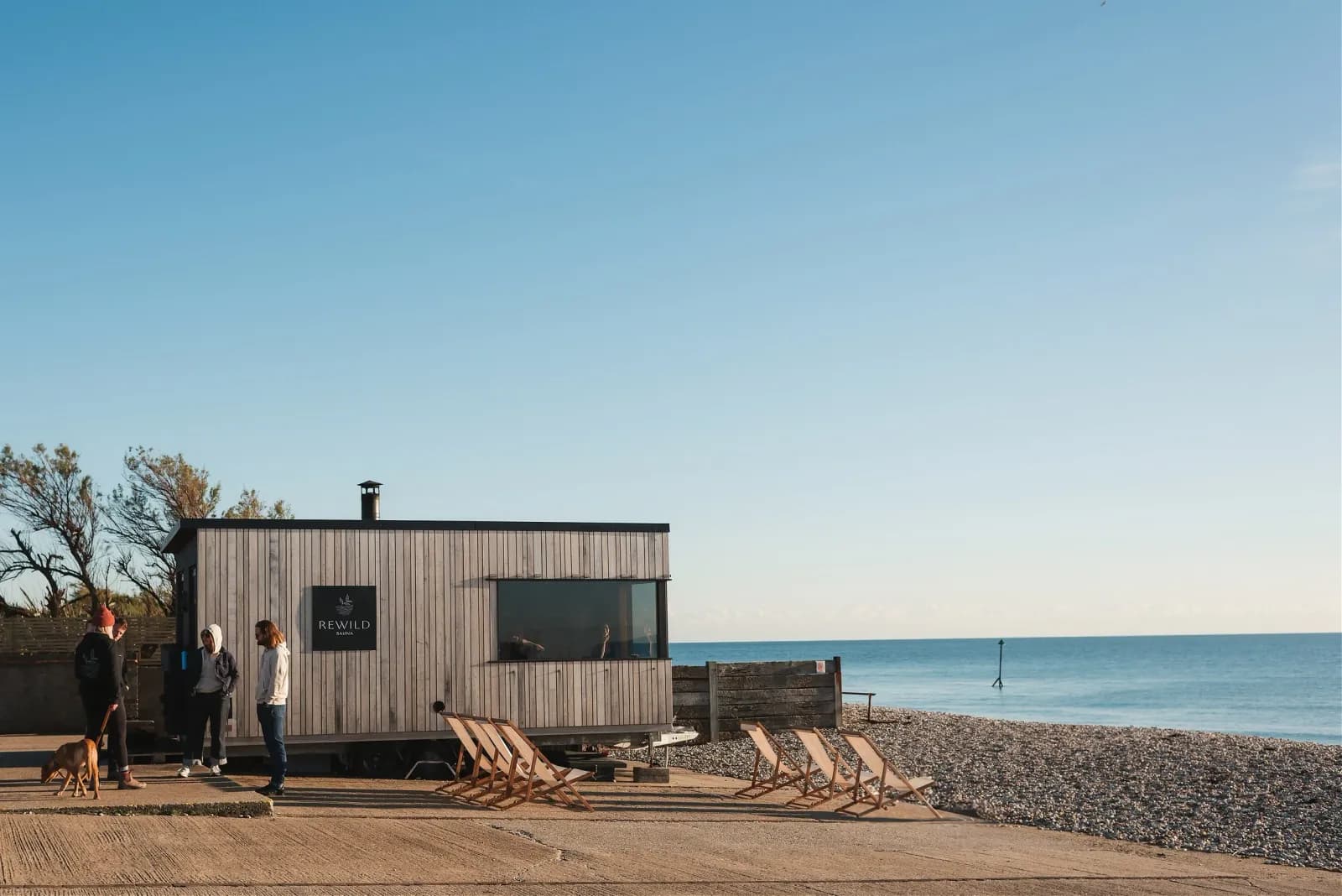 Rewild Sauna deckchairs on a Sussex shingle beach