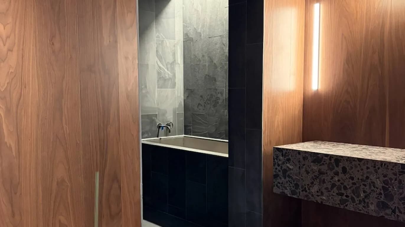 Slate-clad ice bath with American walnut millwork at SAINT NYC
