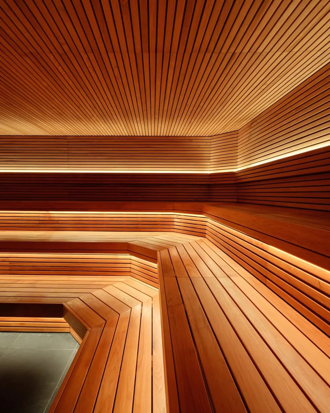 Sant Roch sauna interior with cedar wood benches and ambient lighting