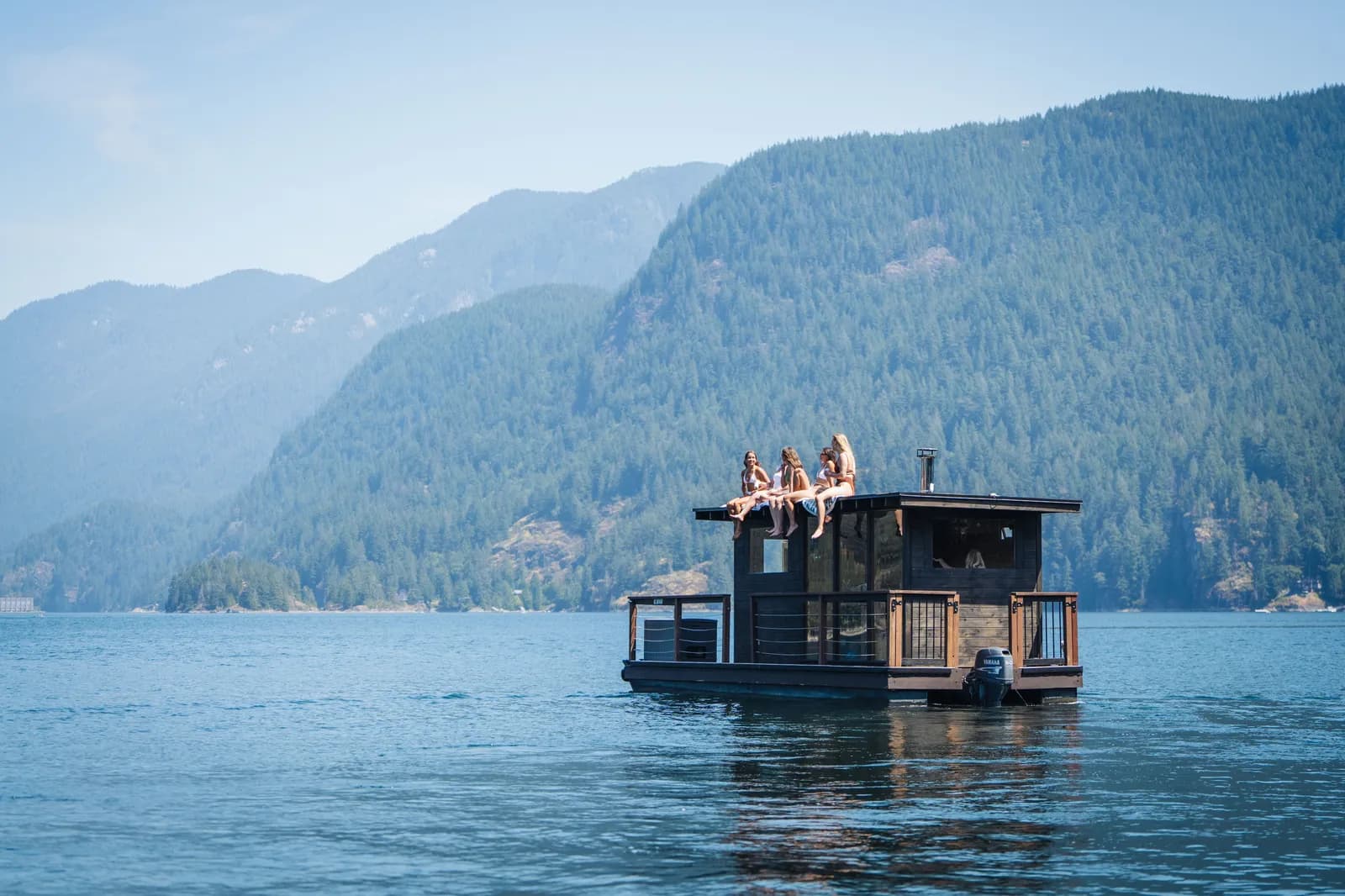 Sisu Swim Sauna boat on the water in Deep Cove